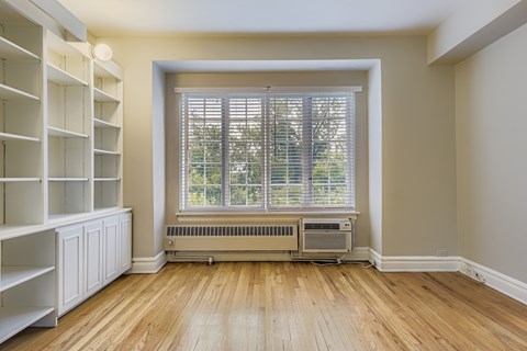 A room with a window and a radiator.